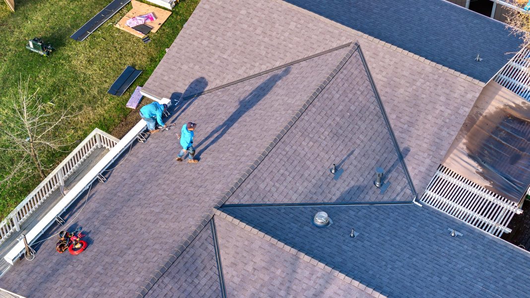 Overhead drone view of MEC Builds crew on roof