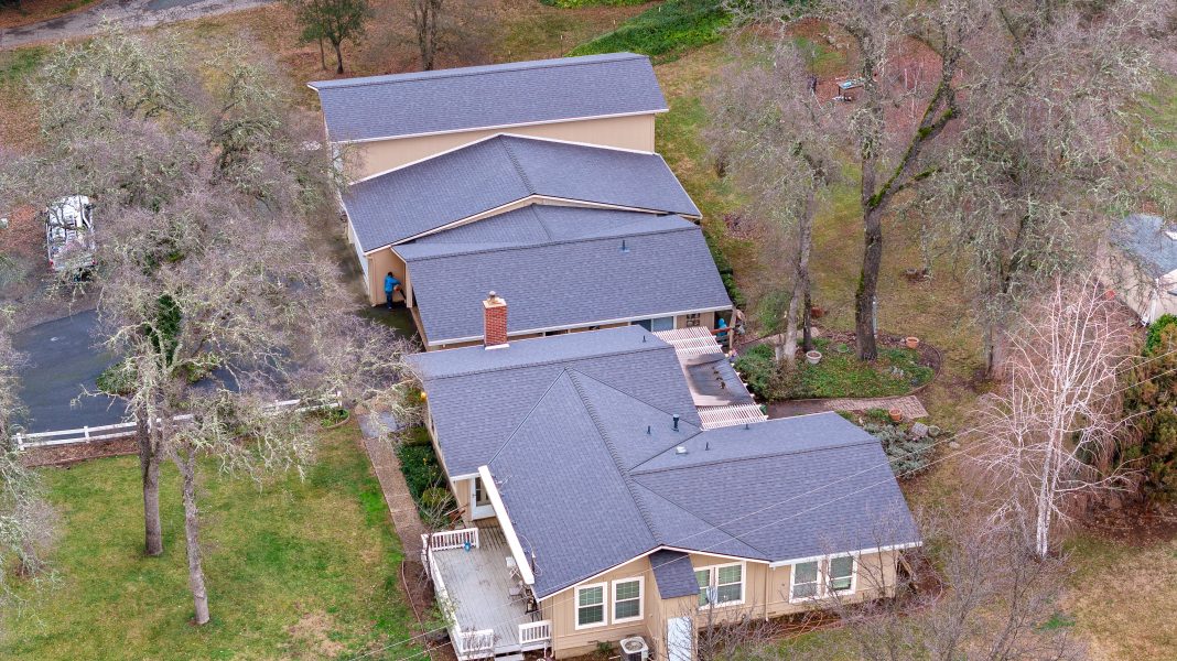 Overhead drone view of shingle roof showing wear